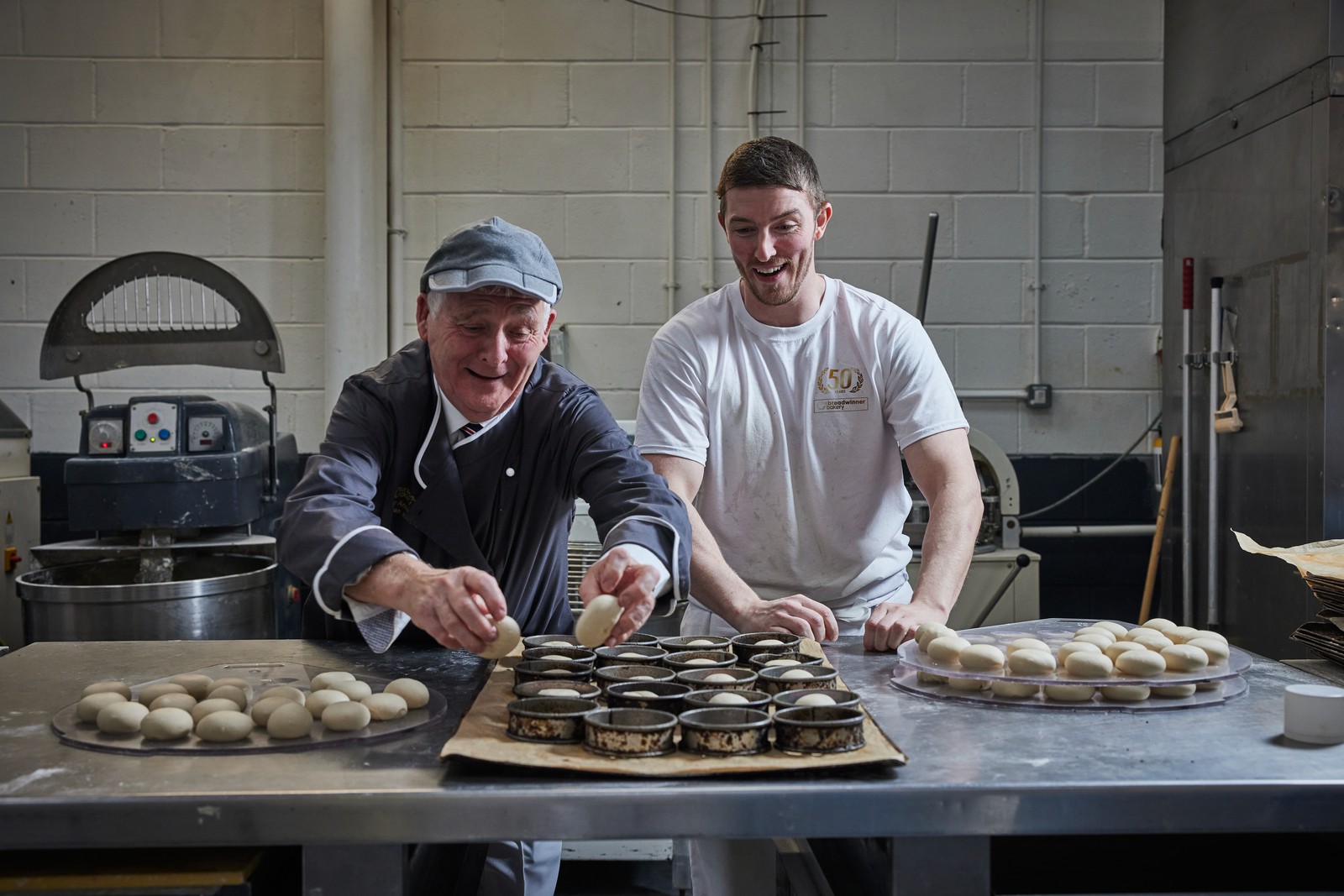 Bakers portioning rolls in the Edinburgh bakery